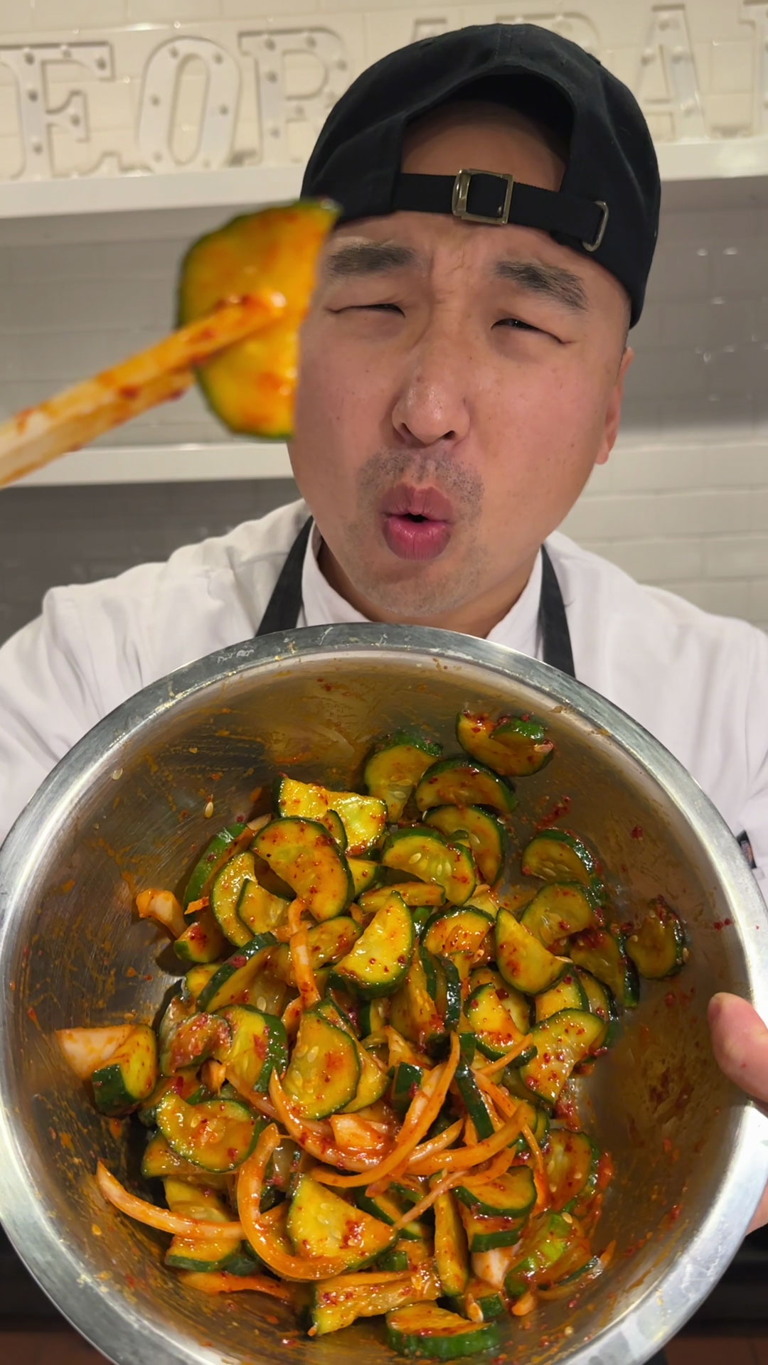 Chef Chris Cho making Spicy Cucumber Banchan 