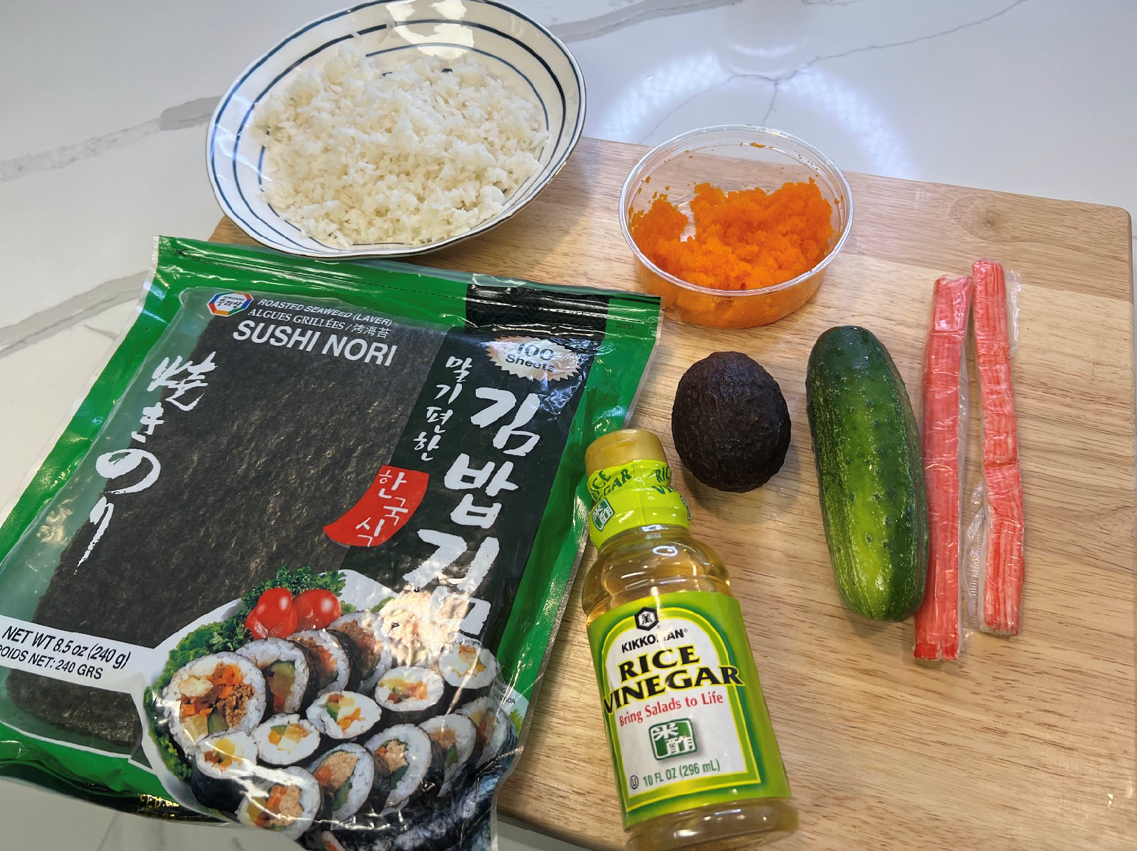 Rice, Tobiko, Nori Sheets, Rice Vinegar, Avocado, Cucumber, and Imitation Crab