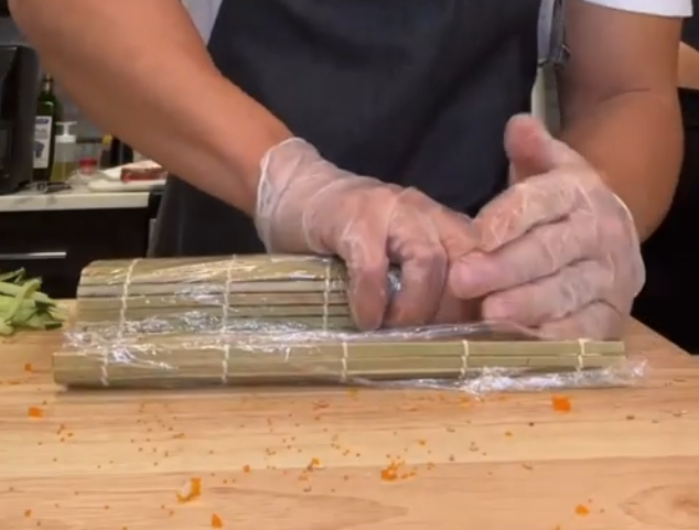 Tucking the ends of the sushi 