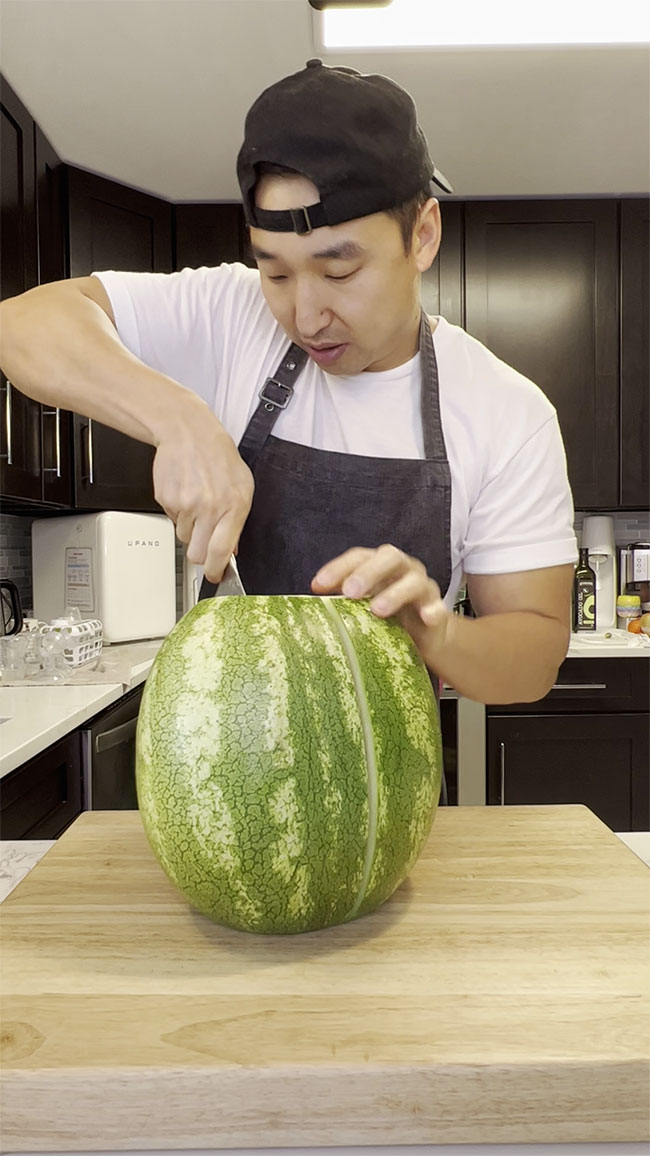 Cut the watermelon in half 