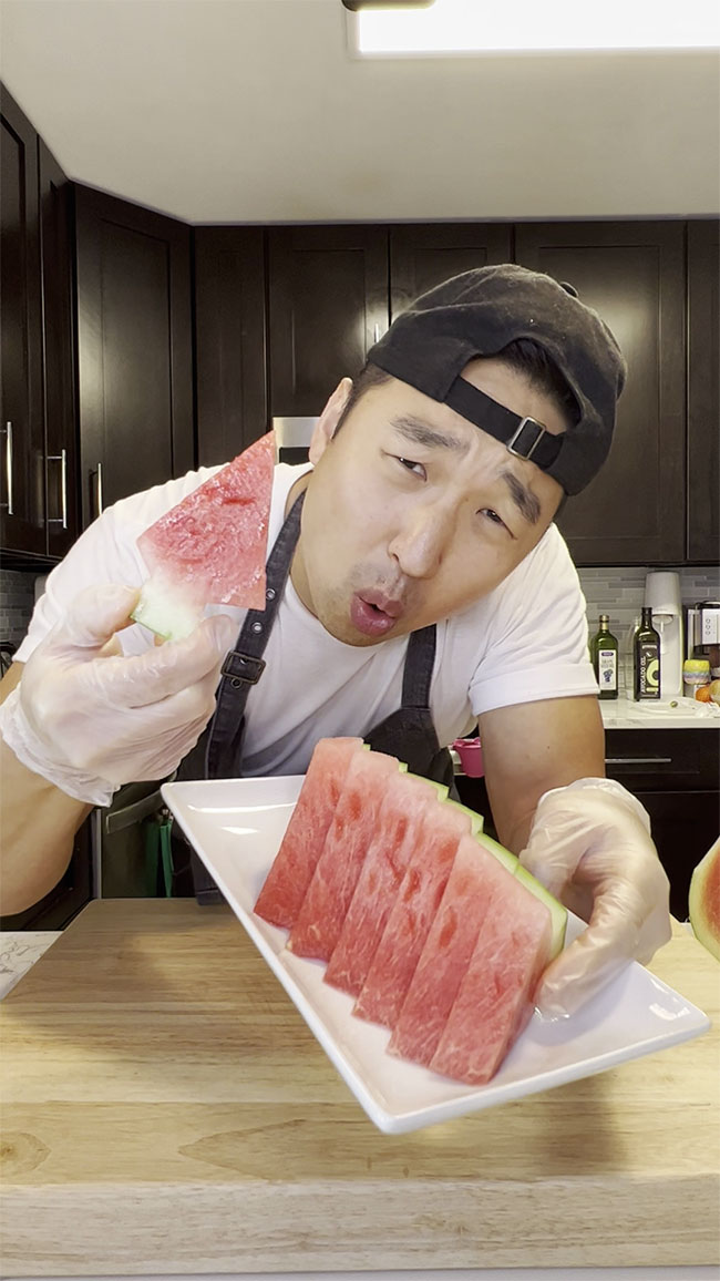 Chef Chris Cho cutting watermelon