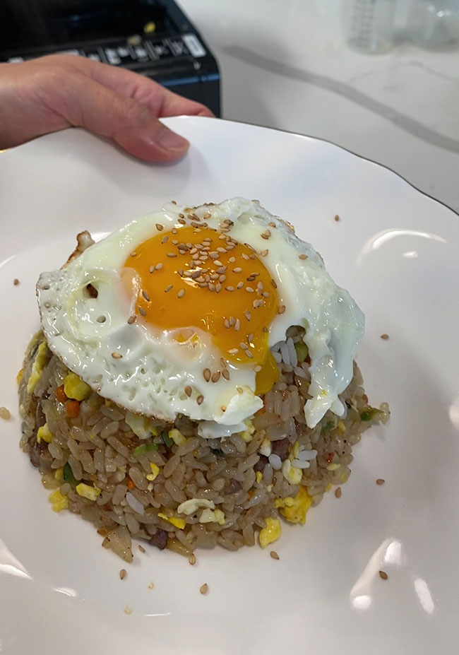 Premium Photo  Fried rice with pork and fried egg in japanese