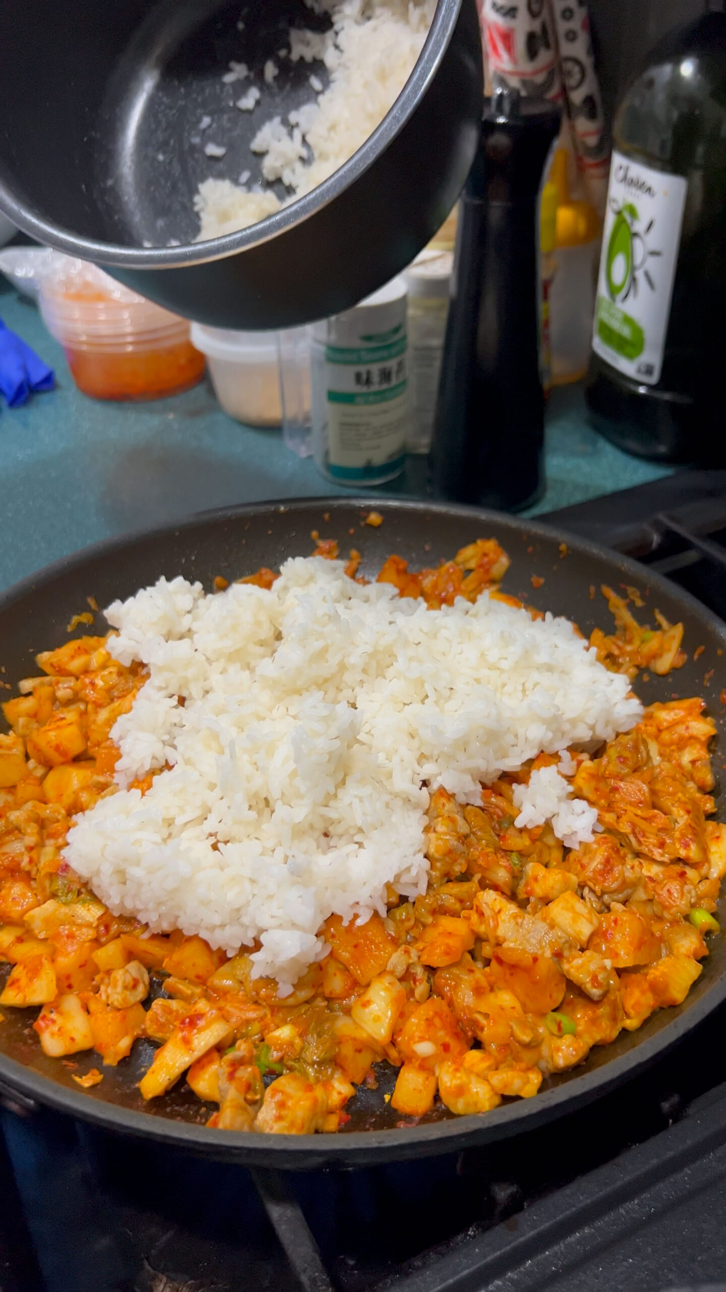 Add rice into the pork and kimchi