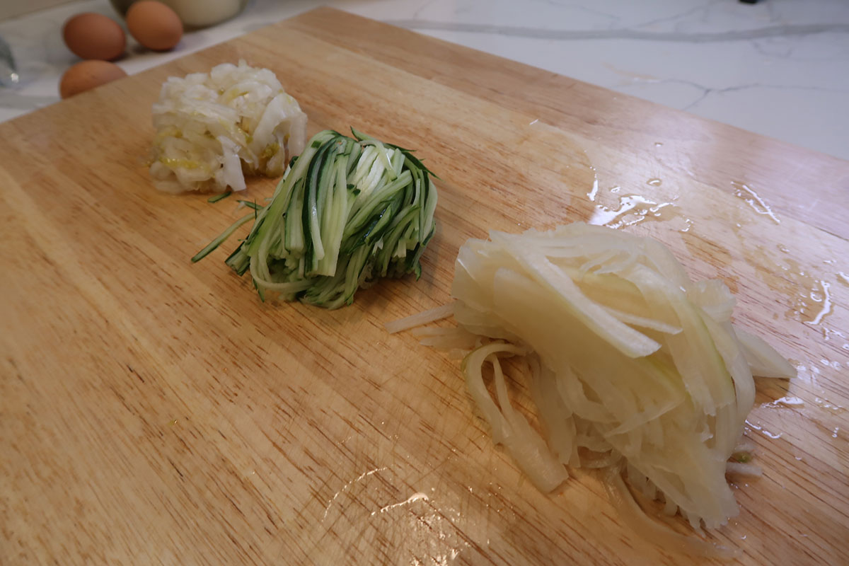 Julienned white kimchi, cucumber, and pickled radish 