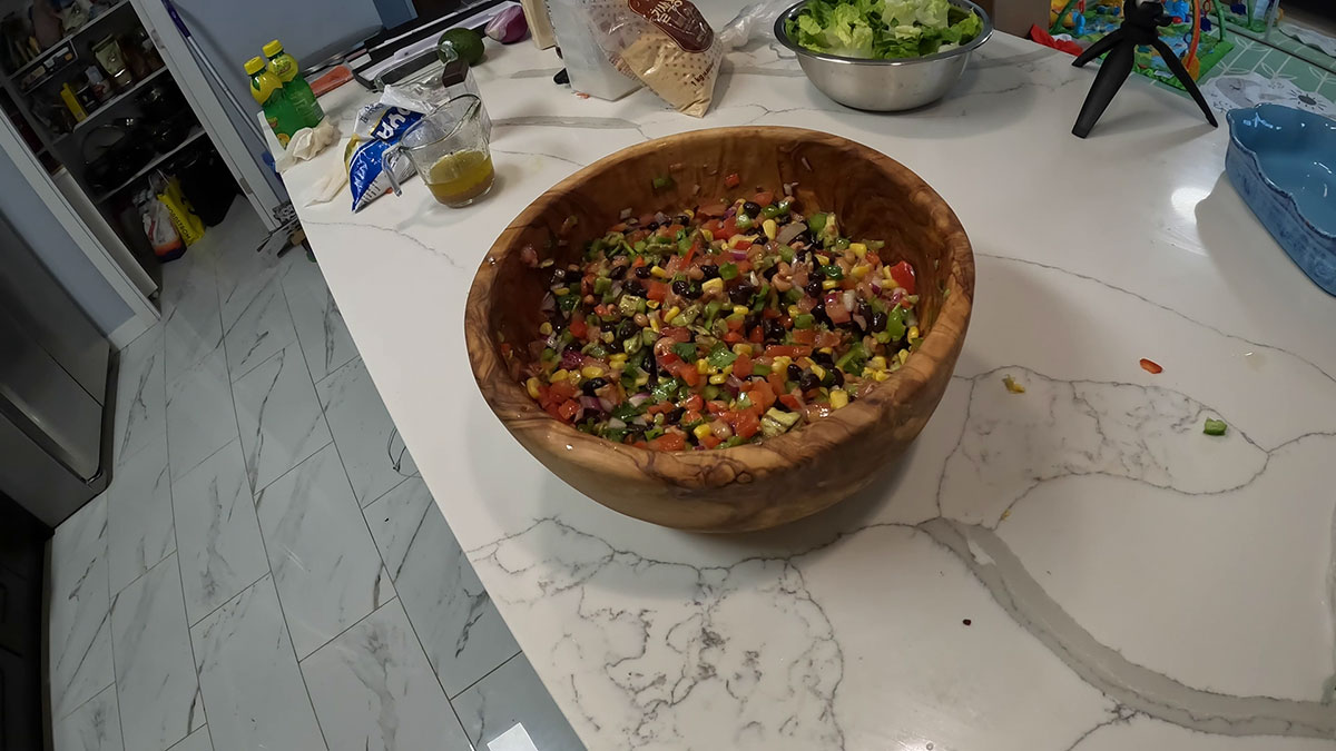 Cowboy Caviar ingredients mixed up in the salad bowl