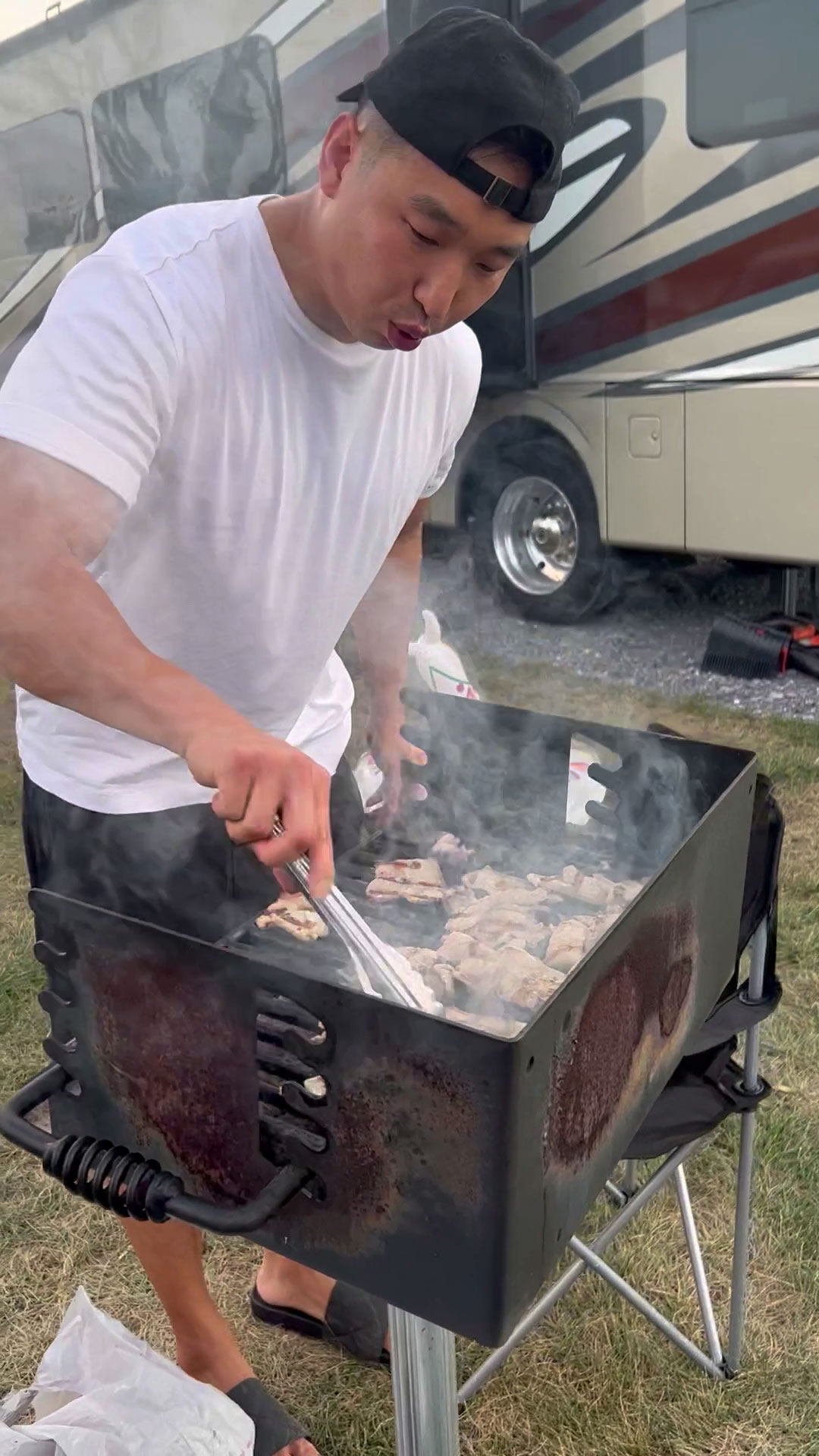 Chef Chris Cho grilling pork belly 