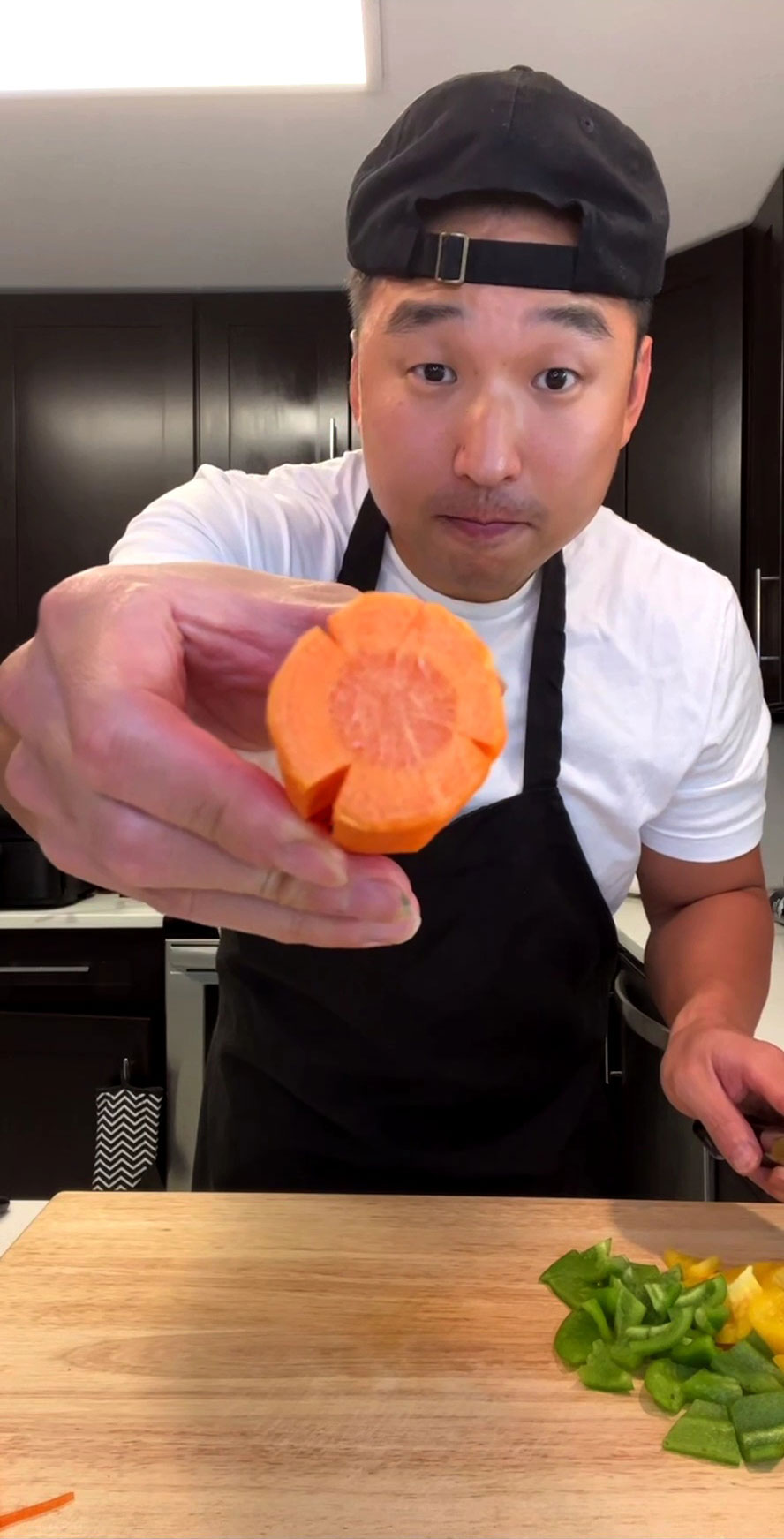 Chef Chris Cho showing how to cut carrots in flower shapes 