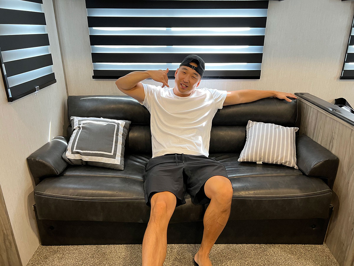 Chef Chris Cho in an RV sofa 