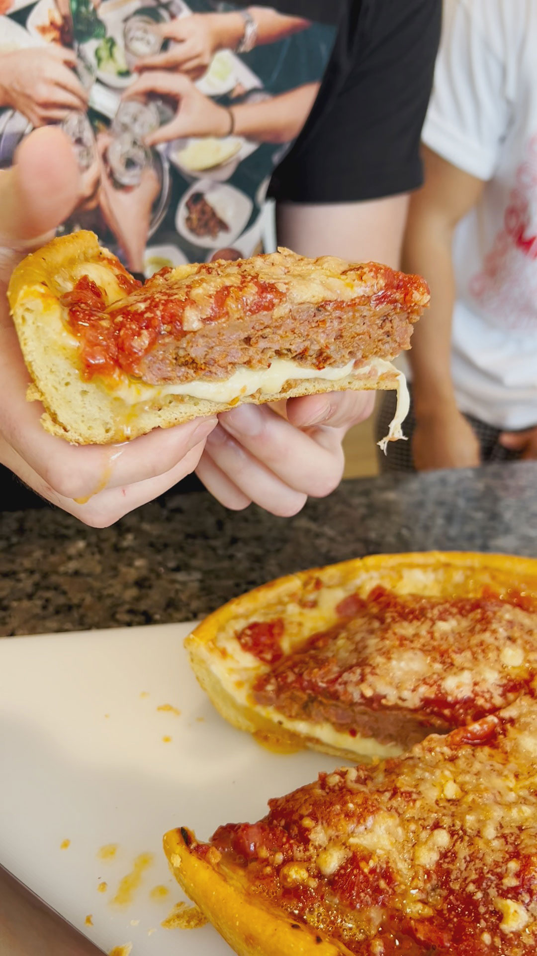 Cross section view of a slice of deep dish pizza