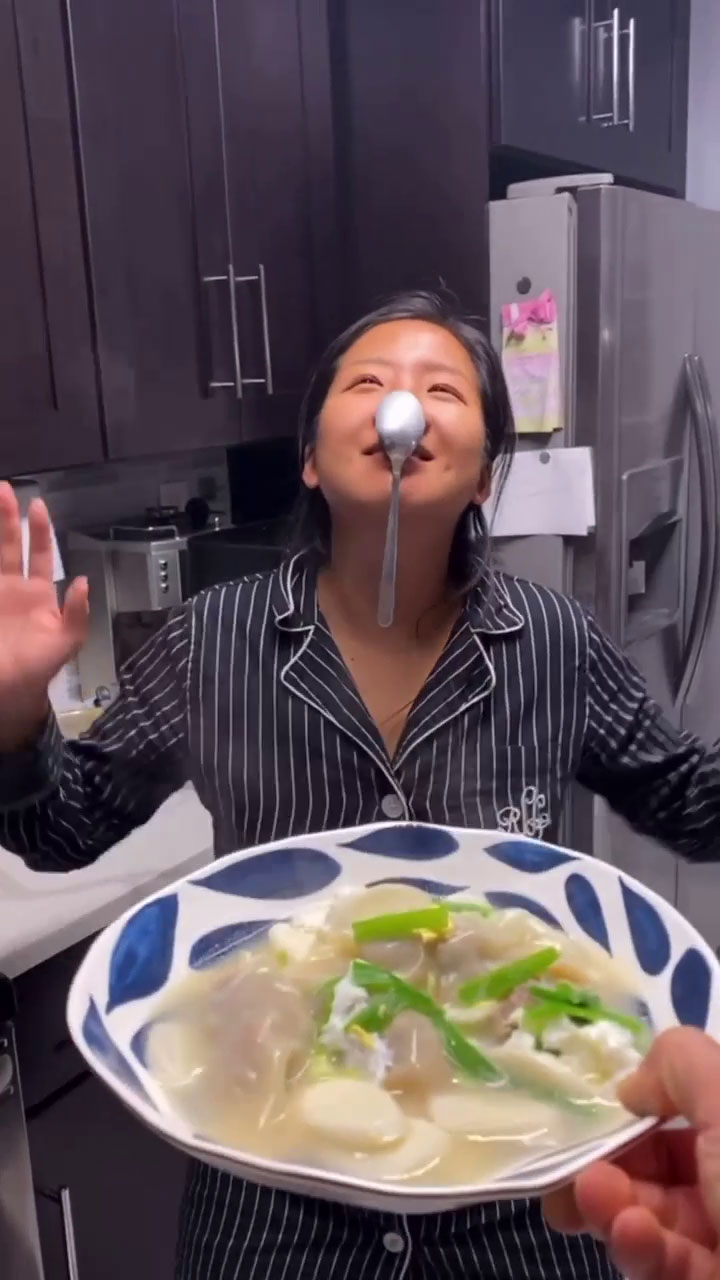 Chef Chris Cho's wife and a bowl of mandu guk