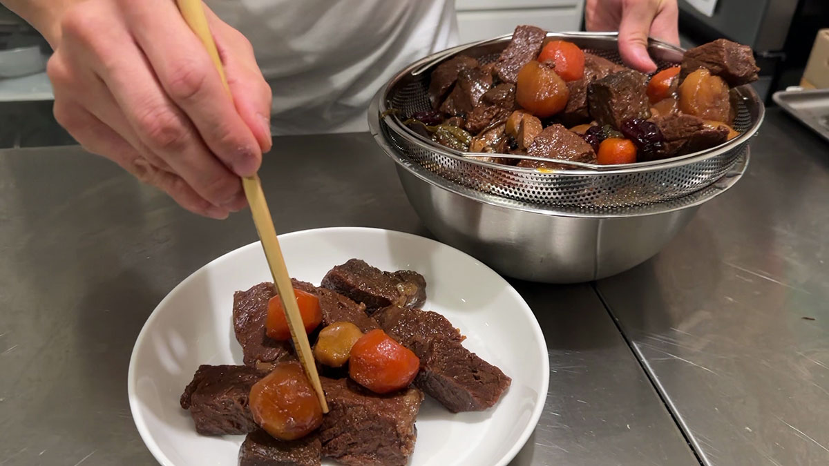 Plating the braised short ribs