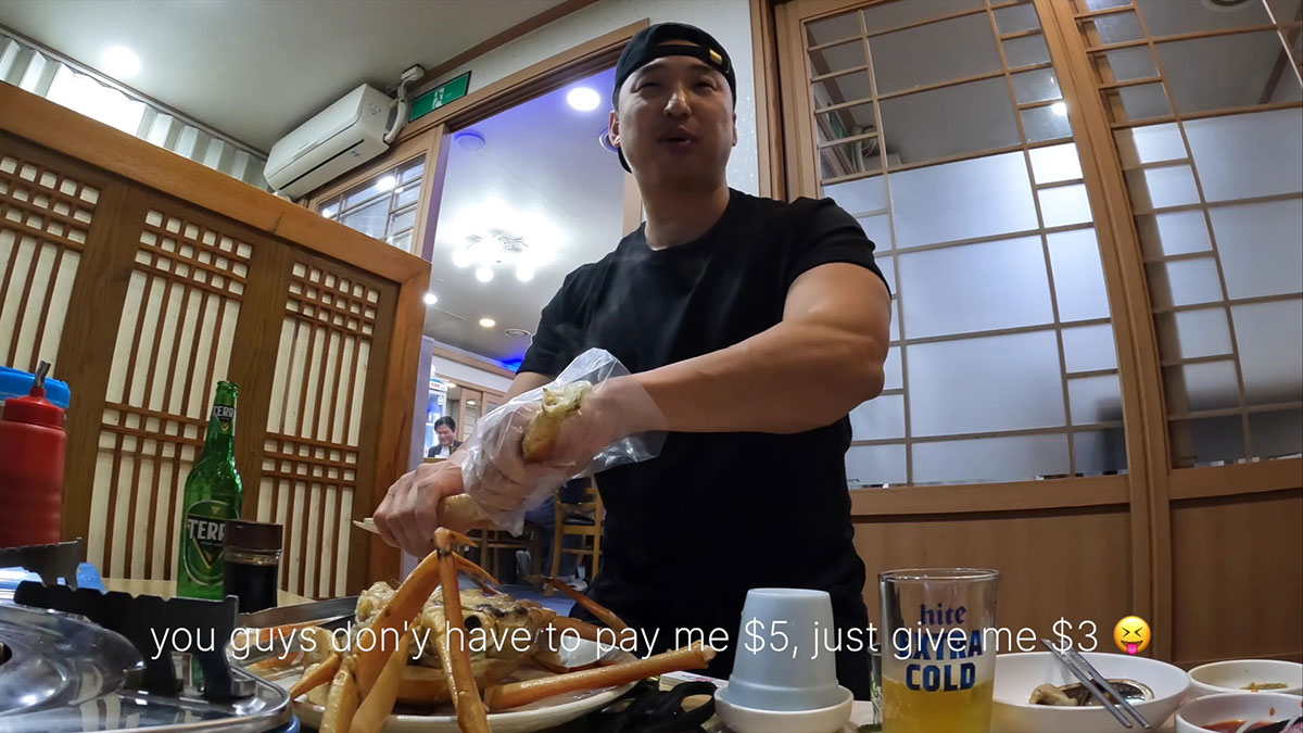 Chef Chris Cho deshelling the king crab 