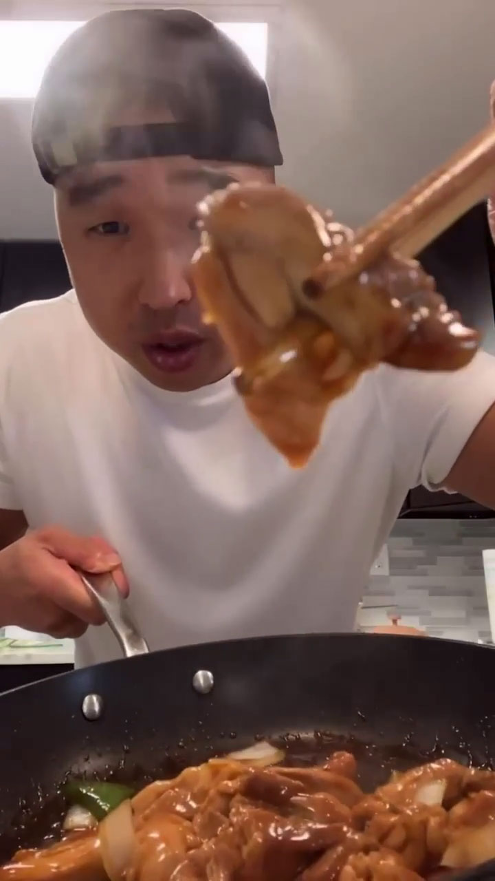 Chef Chris Cho holding chicken teriyaki 
