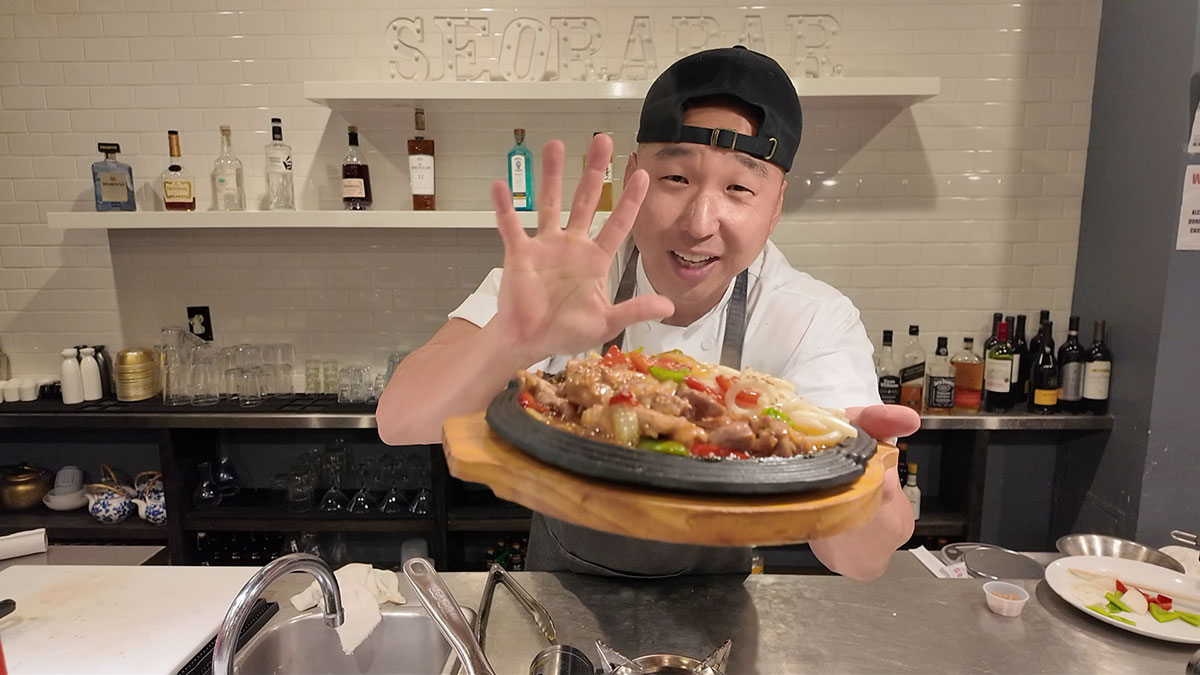 Chef Chris Cho making chicken teriyaki