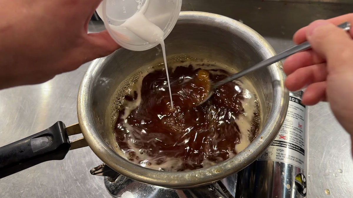 Bring the sauce to a boil and add slurry