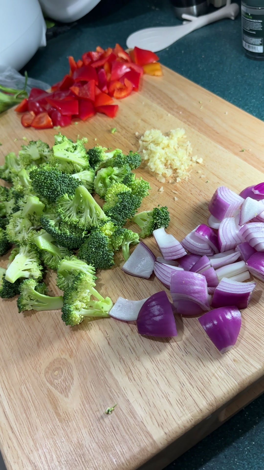 Chop garlic, peppers, broccoli, and onion 