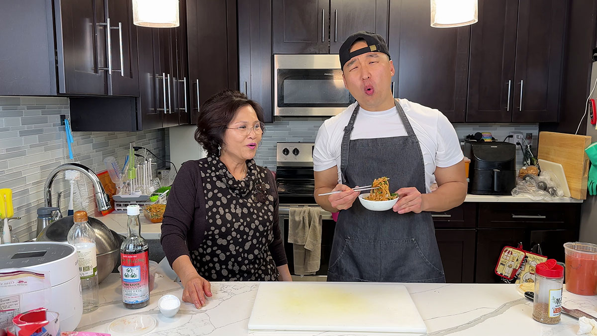 Mama Cho and Chef Chris Cho making spicy radish salad 