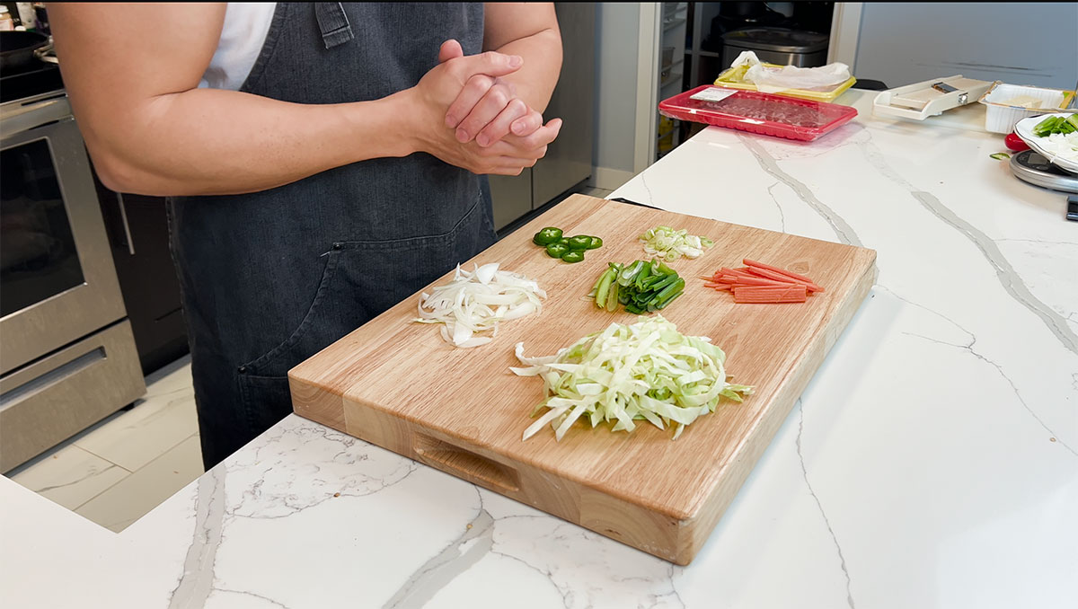 Vegetables for spicy pork stir fry: Onion, jalapeño, cabbage, scallion, carrots