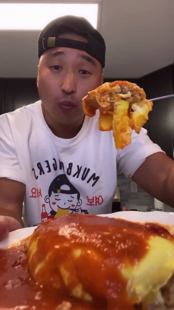 Chef Chris Cho with a bowl of omurice 