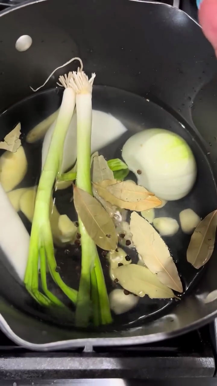 Place water, aromatics, and seasonings in a pot