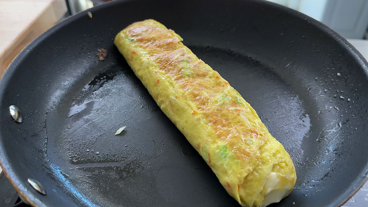 Let the rolled omelette cook through when you achieve your desired thickness