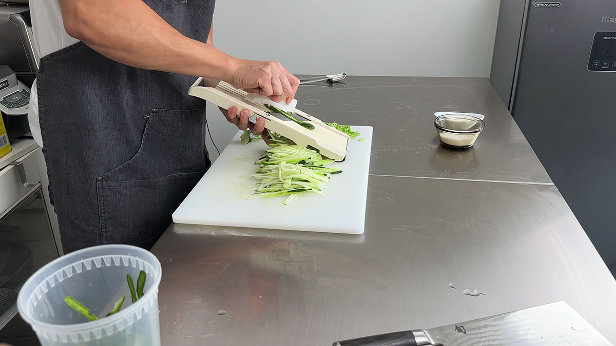 Slicing cucumber using a mandolin