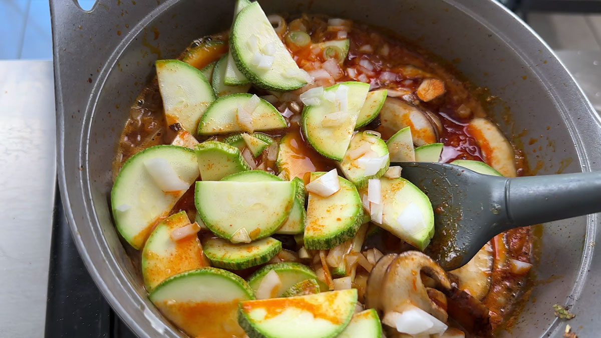 Add seafood and vegetables in soondubu 
