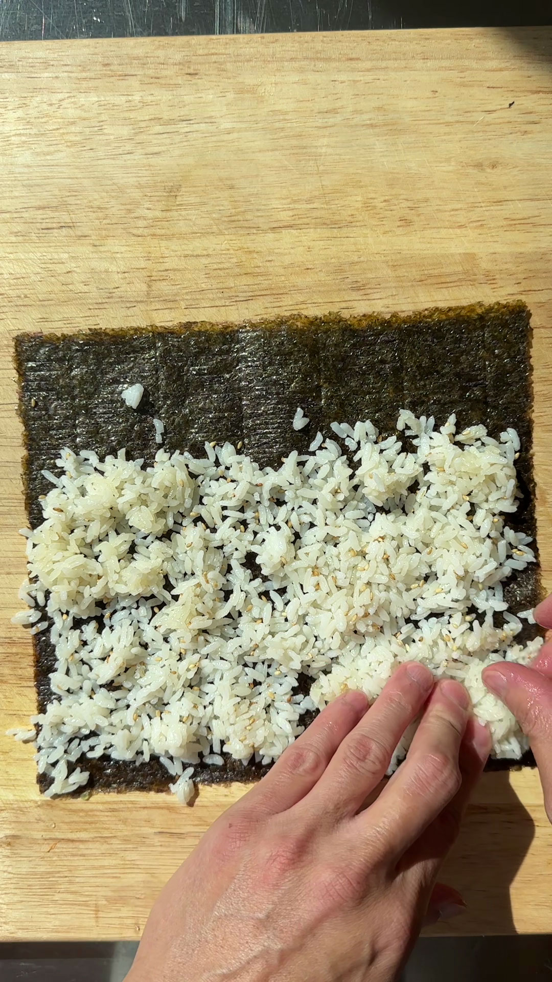 Spread the rice flat on the nori sheet 