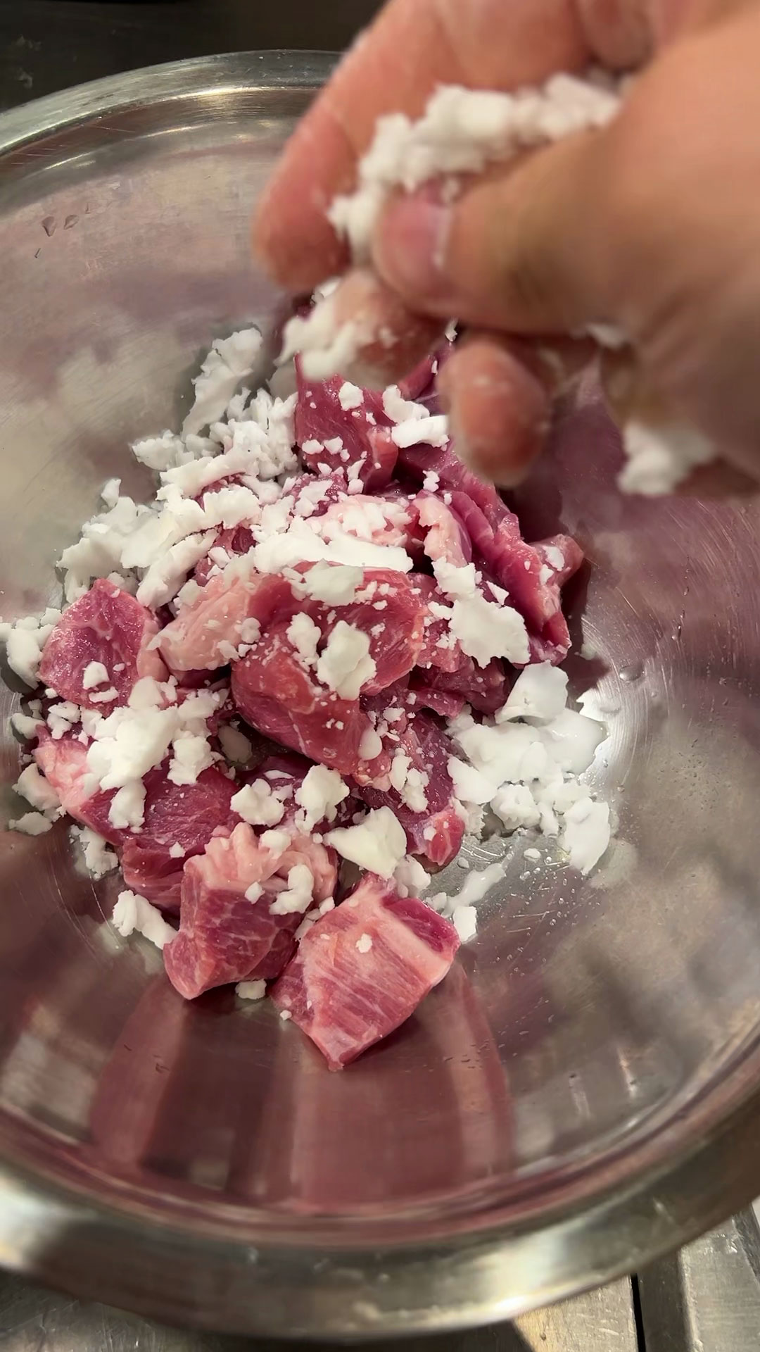 Crumbling potato starch batter into the meat 