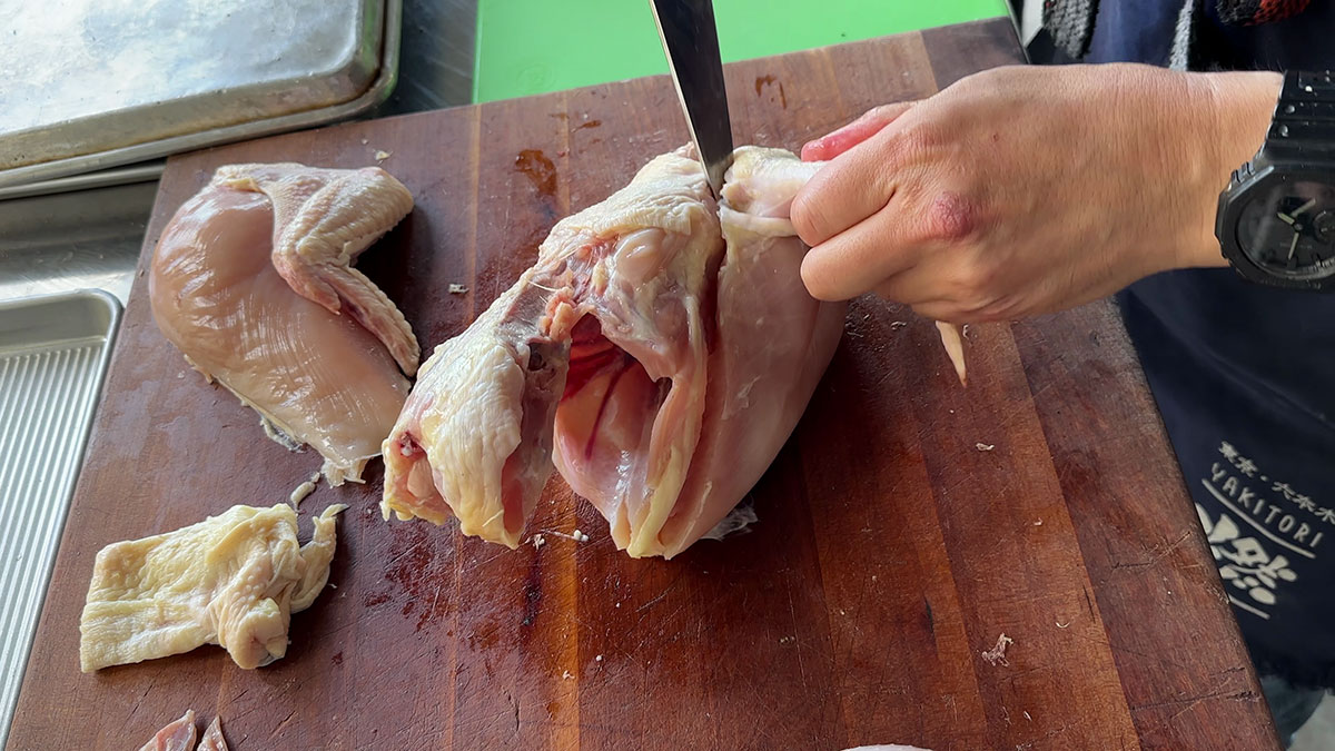 Make an incision along the wings and under the breast 