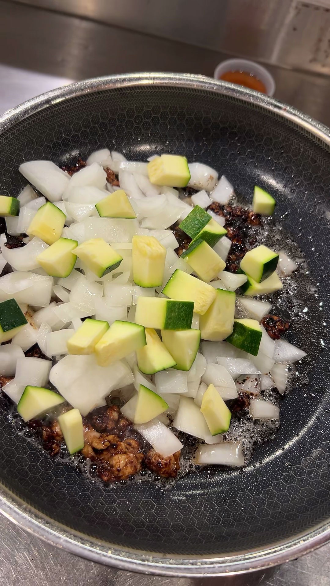 Add zucchini and onion