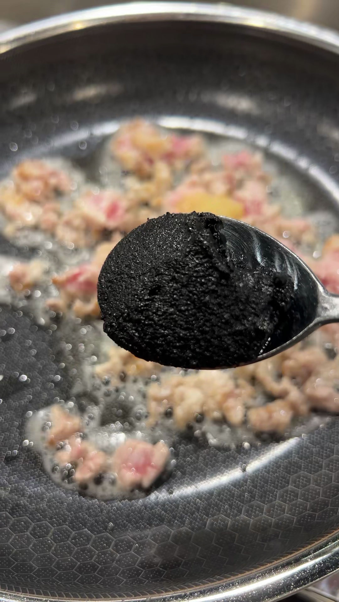 Add black bean paste to sauteed pork