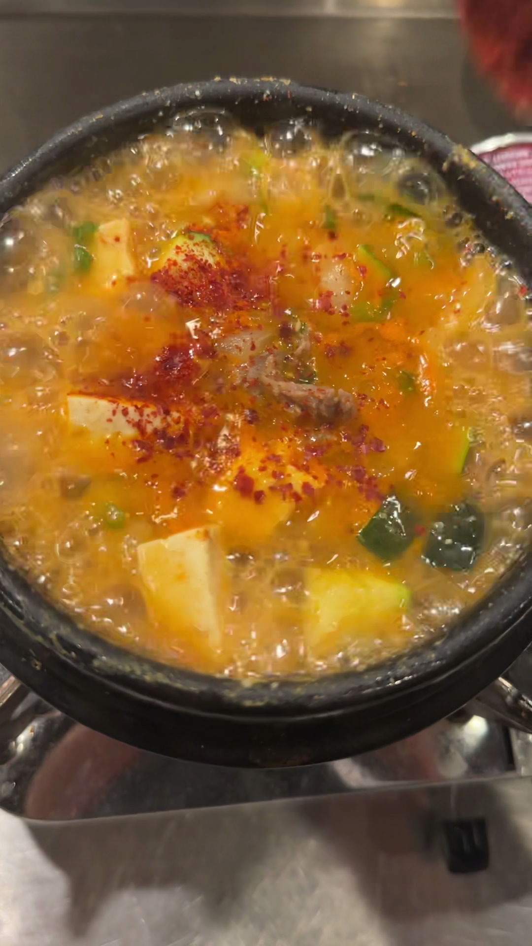 Season doenjang jjigae with garlic, gochujang, and gochugaru