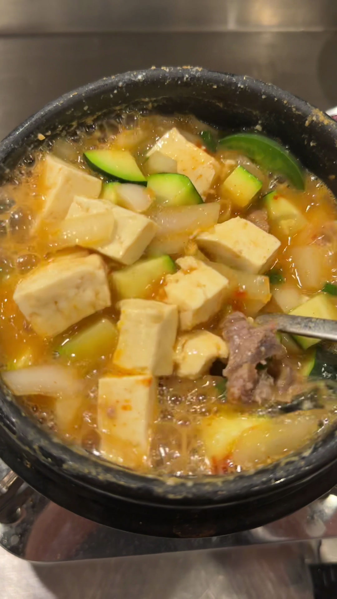 Add meat and veggies to soybean paste soup