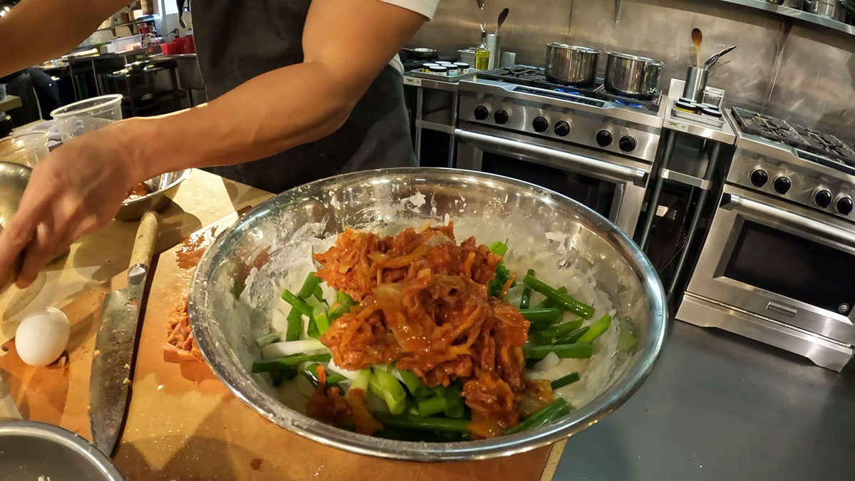Adding kimchi, onion, and scallions in the batter 