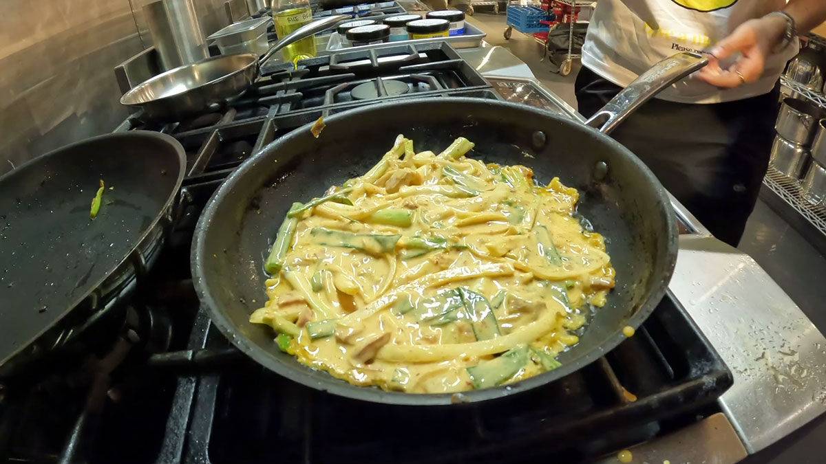 Evenly shape the kimchi pancake batter into the hot pan