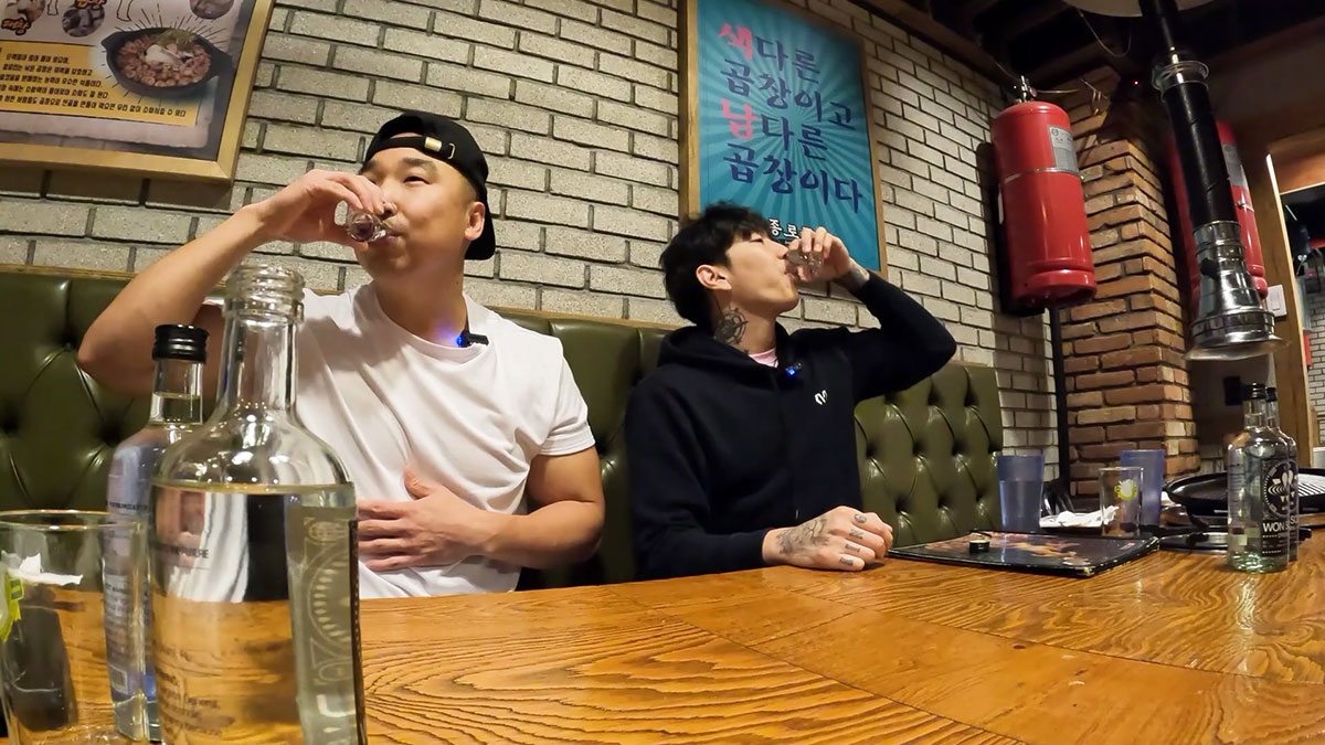 Chef Chris Cho and Jay Park drinking won soju 