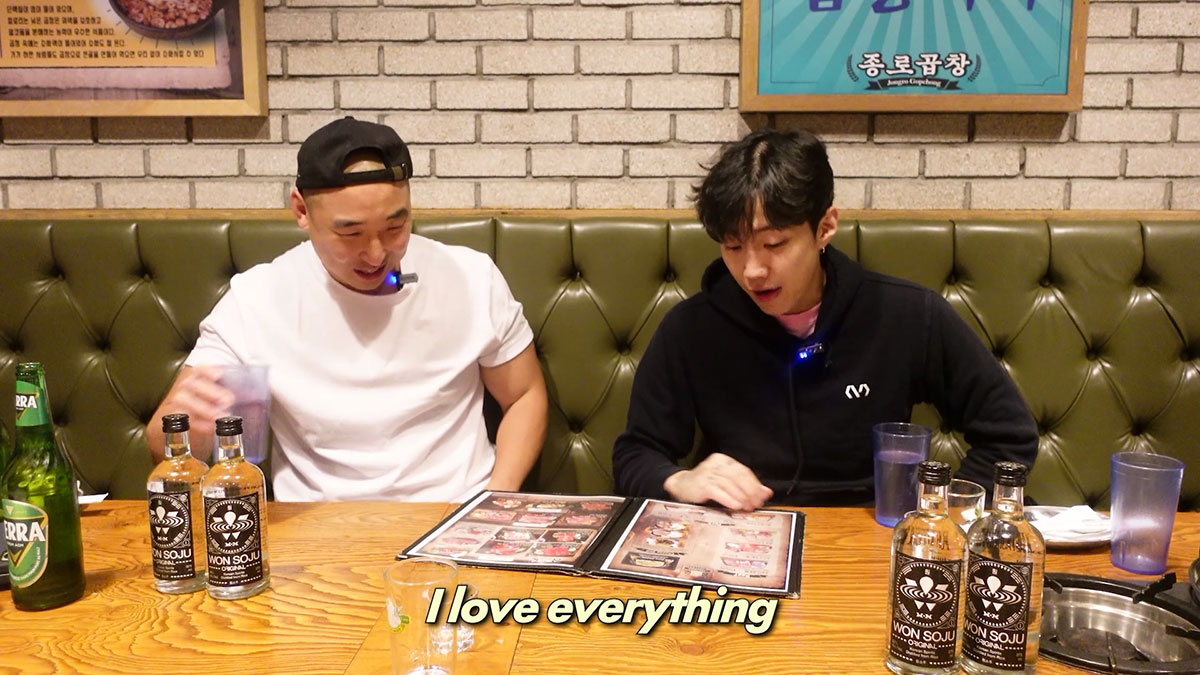 Chef Chris Cho and Jay Park choosing what anjoo to get from the menu 