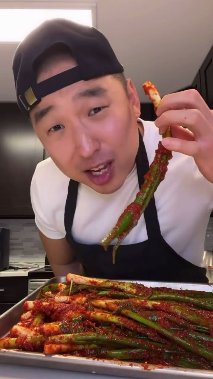 Chef Chris Cho making green onion kimchi