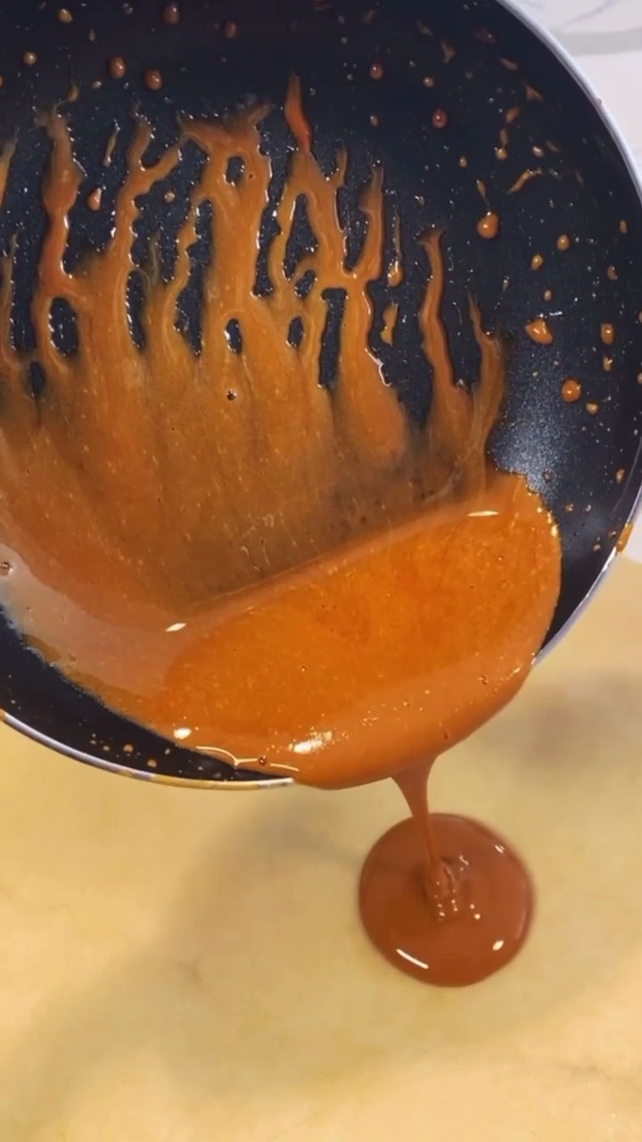 Pour the melted sugar in a flat, oiled surface 