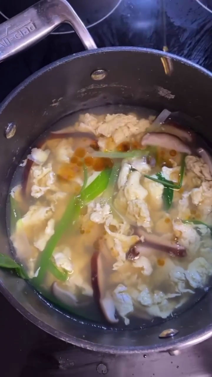 Adding the egg and allowing it to cook before mixing 