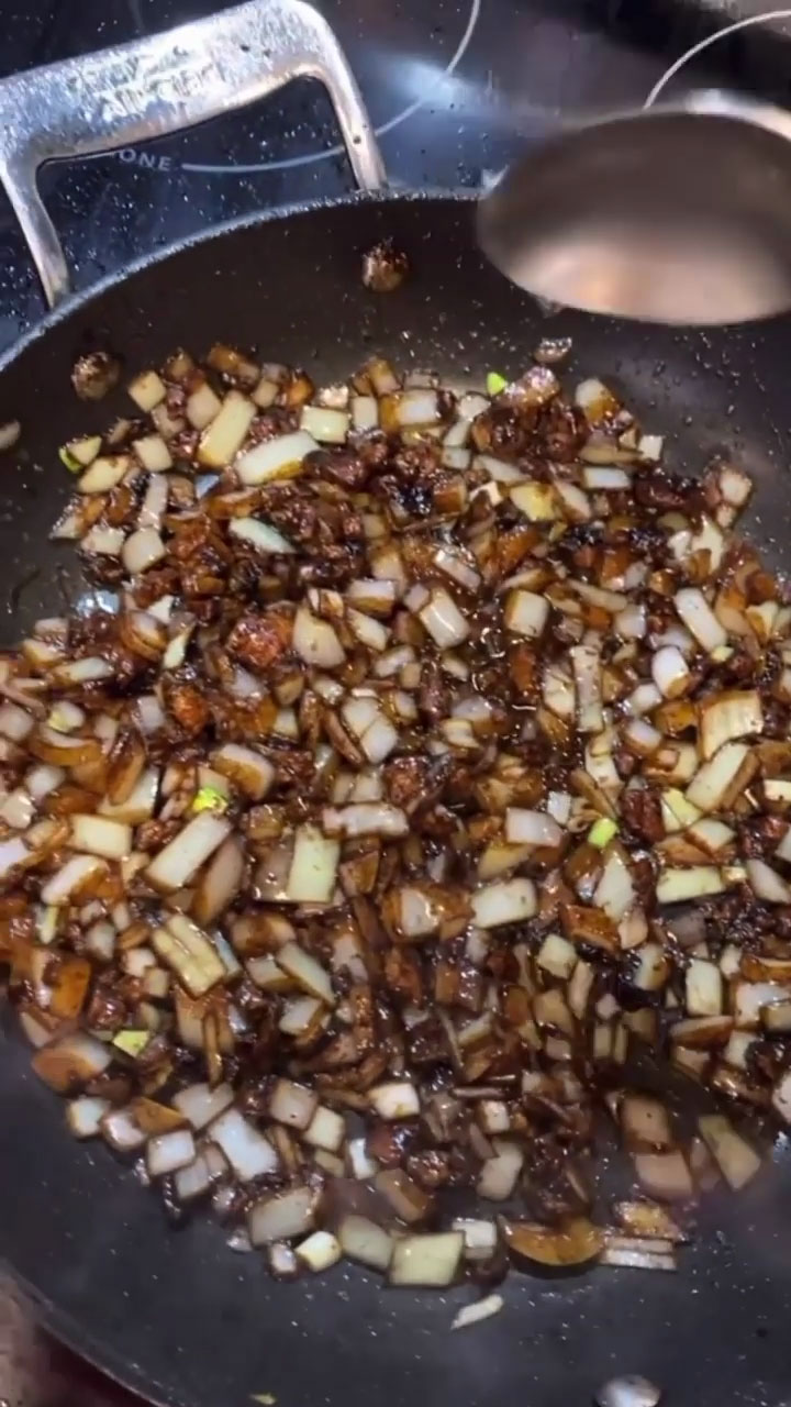 Sauteing the onion with the sauce 