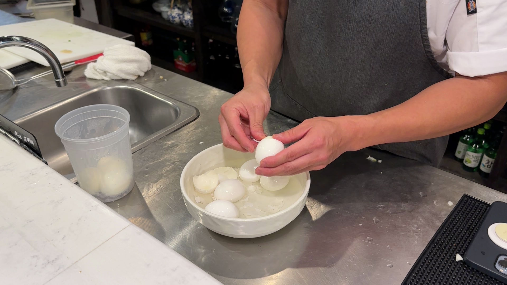 Peeling eggs from an ice bath