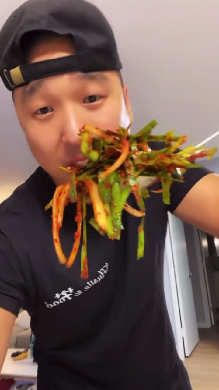 Chef Chris Cho making chive kimchi