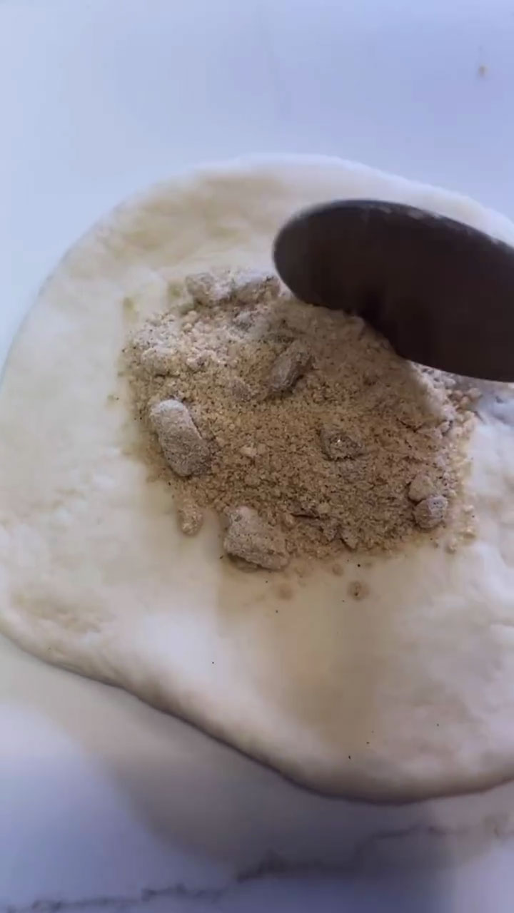 Place cinnamon sugar filling in the middle of the flat dough