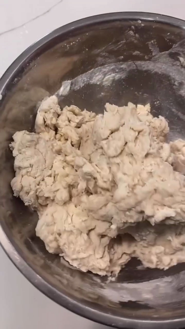 Mix the batter to form a crumbly dough