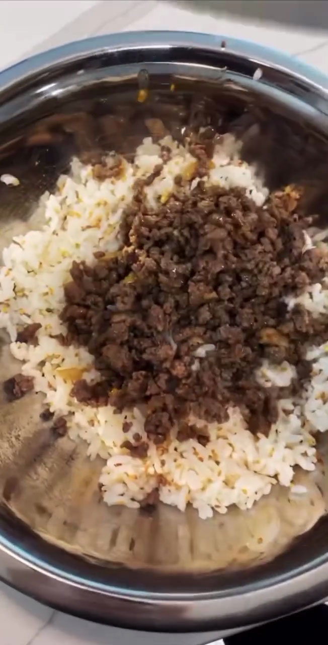 Add the ground beef to the seasoned rice 