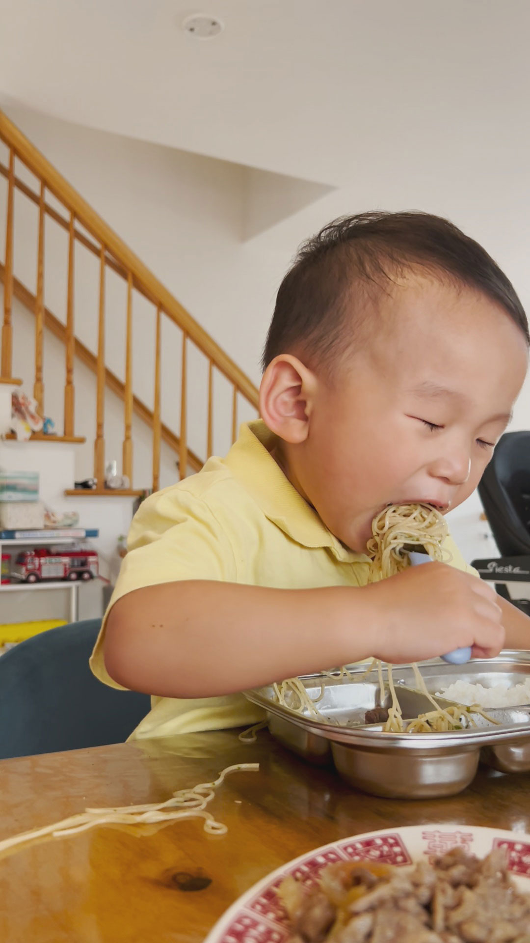 Carter enjoying the garlic noodles