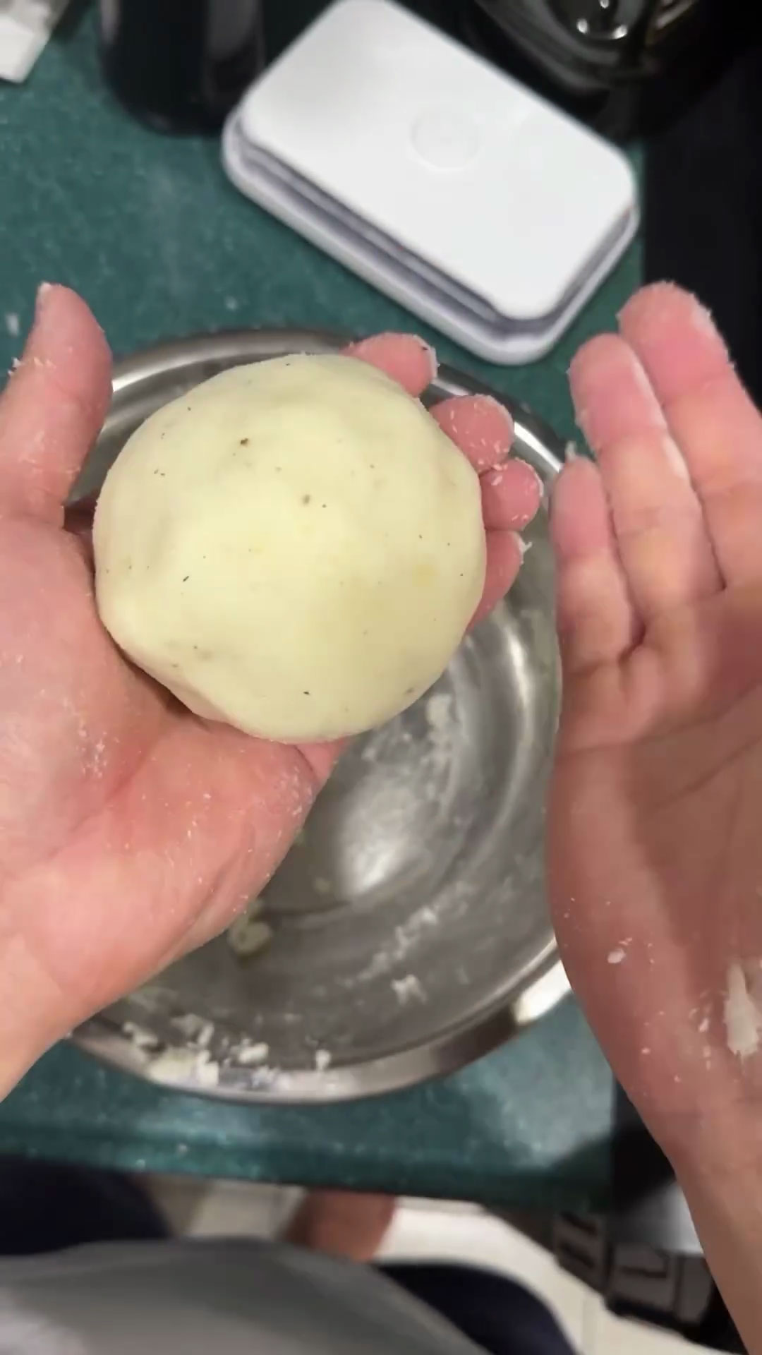 Shape the cheese-filled potato into a ball