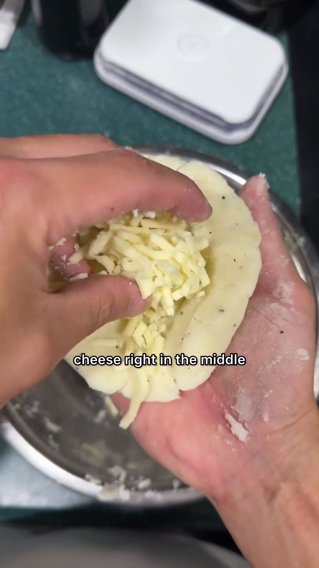 Place mozzarella cheese in the middle of the potato mixture 